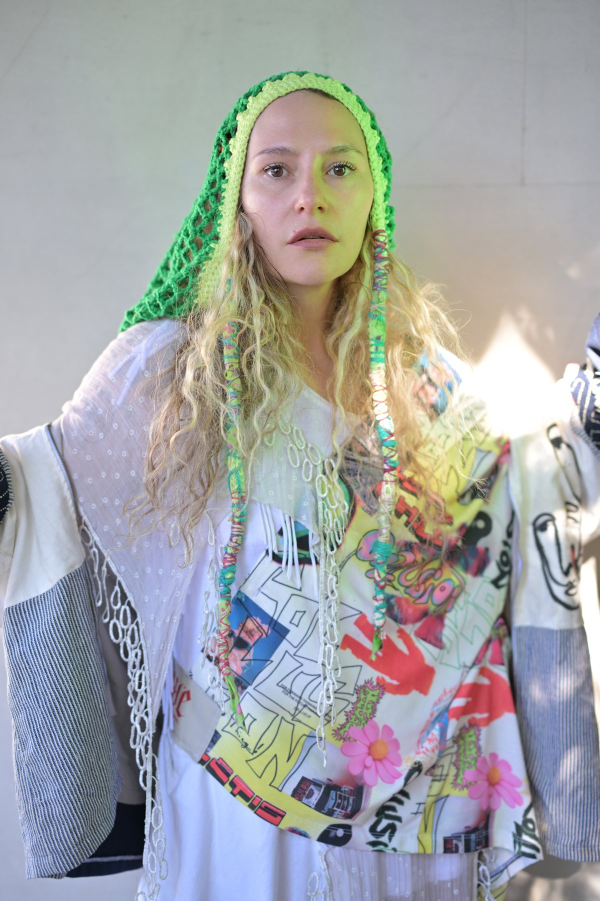 Custom upcycled patchwork piece with green crochet hood