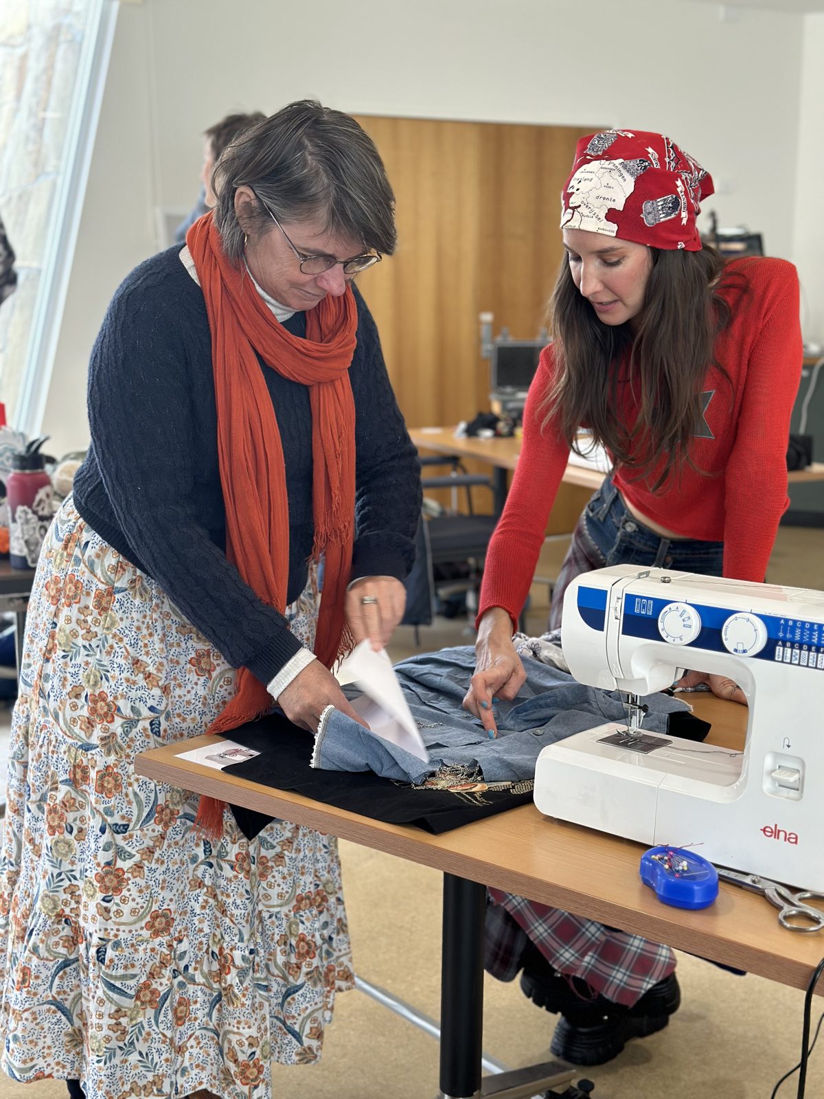 Erica helping a participant at the sewing machine